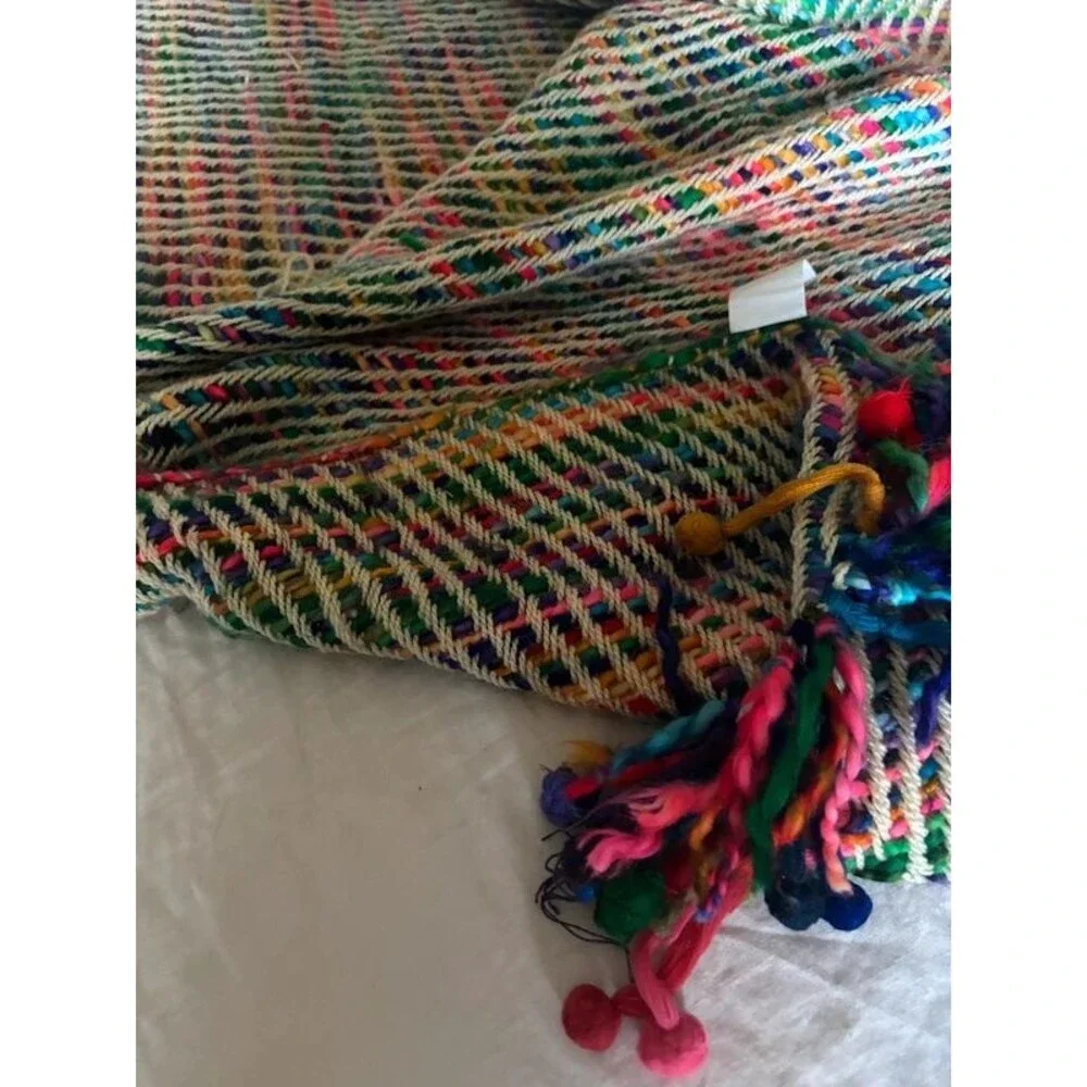 Colorful woven throw blanket with tassels/fringe